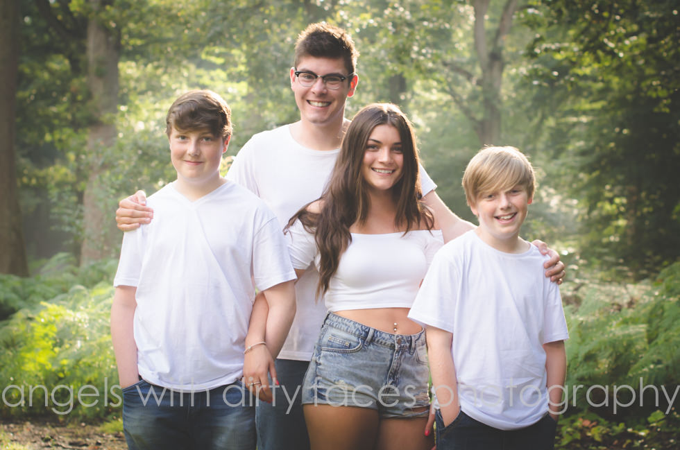 family photography in welwyn garden city with cousins in woodland setting