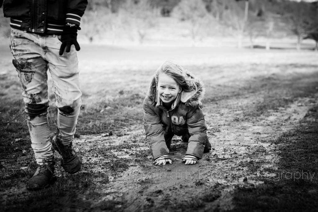 young boy falls in the mud during his Family Lifestyle Photography in Hertfordshire