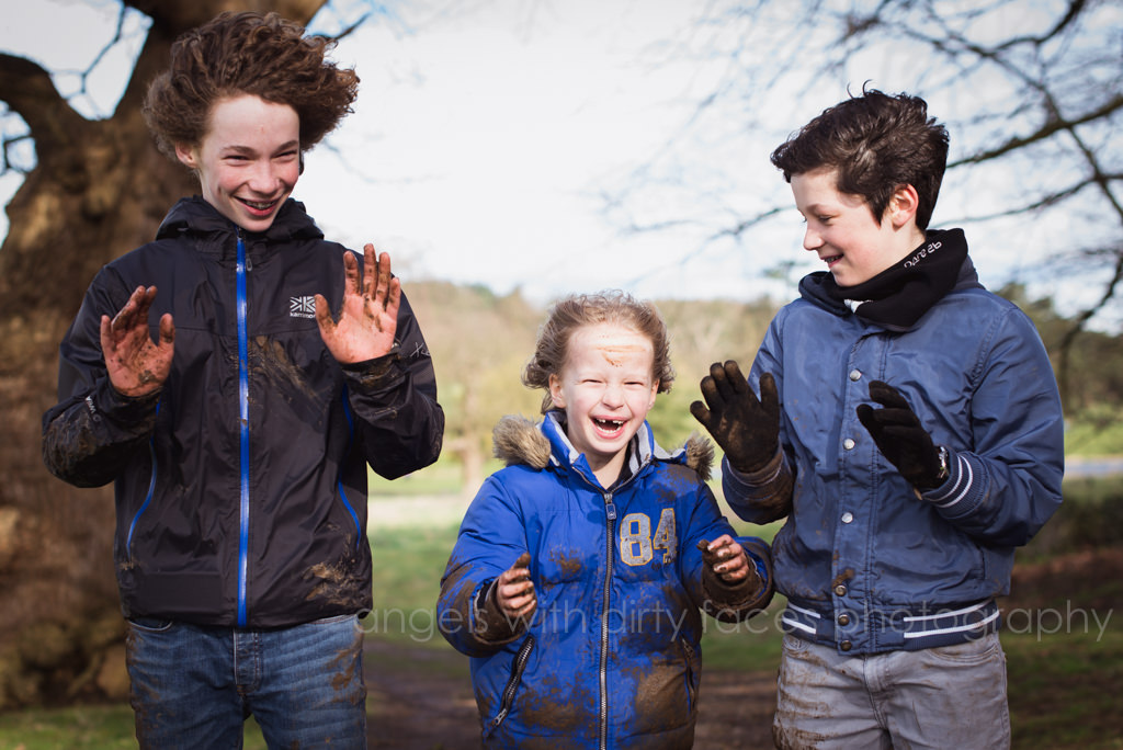 three siblings share a joke during their Family Lifestyle Photography in Hertfordshire