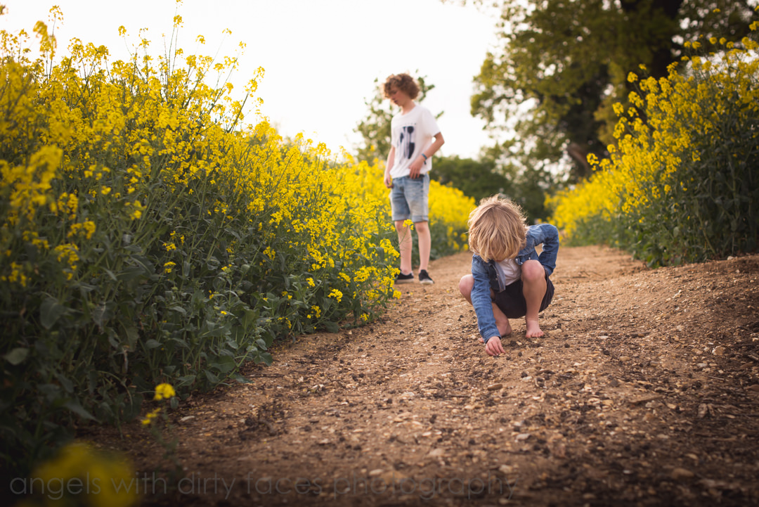 Photographer documents Family lifestyle with brothers collecting stones in Hertfordshire