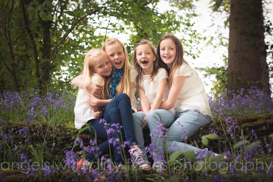 Welwyn Garden family photographer in the bluebell woods with cousins