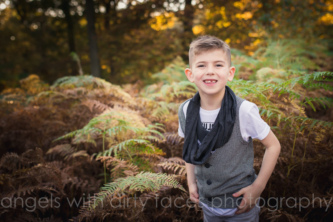 portrait of young boy in hertfordshire woods