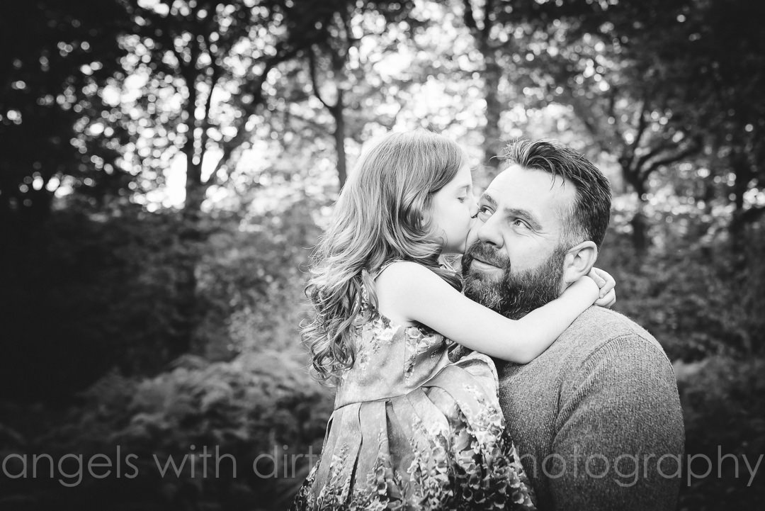 father and daughter share kiss during their Natural Family Photoshoot Hertfordshire Family Photographer