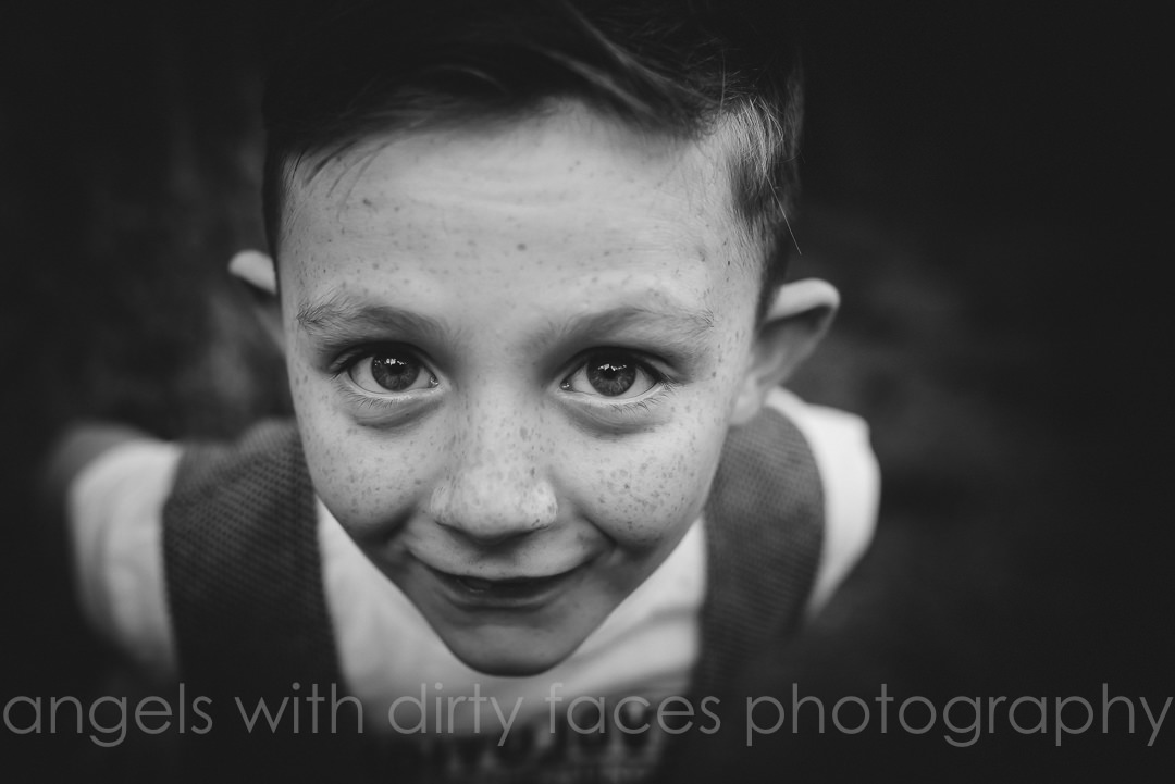 Natural Family Photoshoot of close up portrait of boy in black and white
