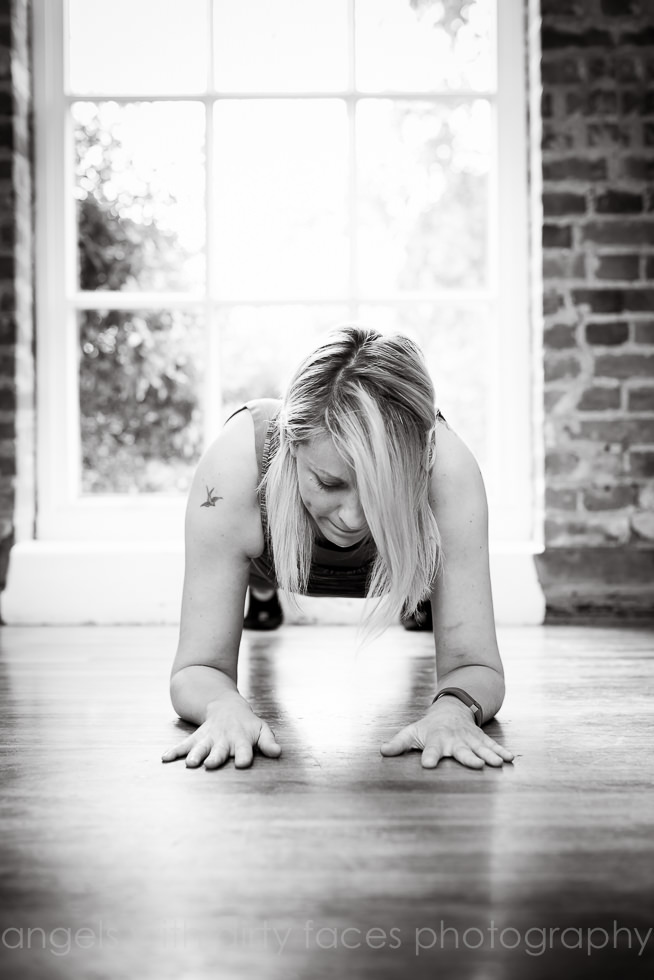 Pilates instructor does the plank during commercial Photography in Welwyn Garden City