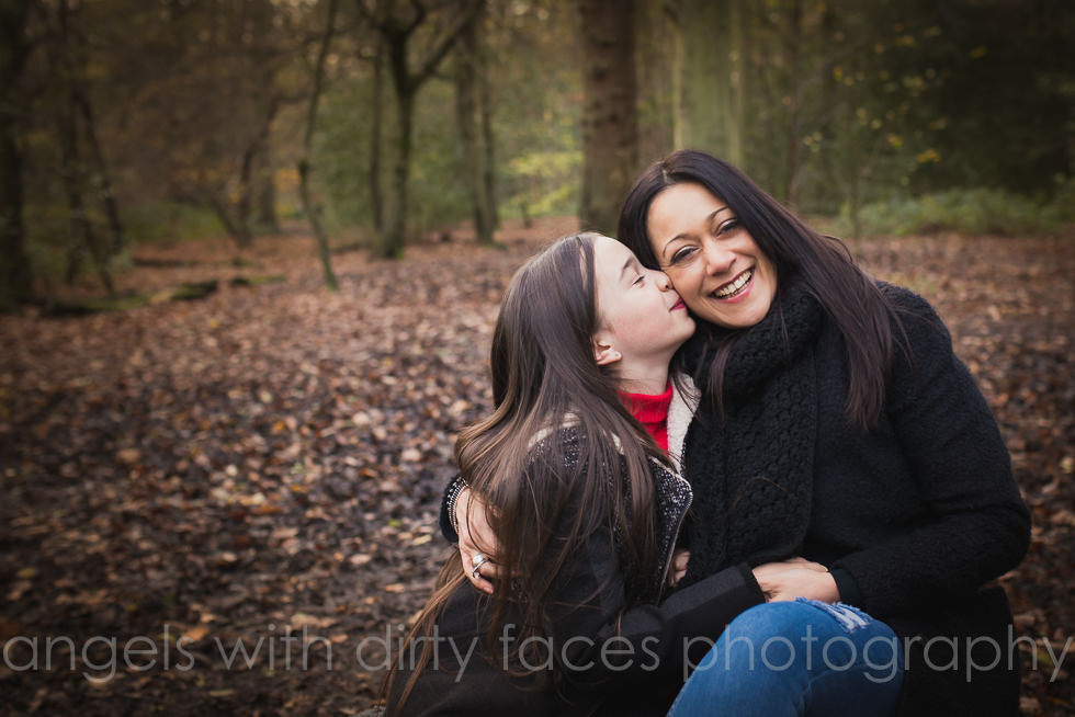 daughter kissing mum at Winter Photoshoot in Hertfordshire