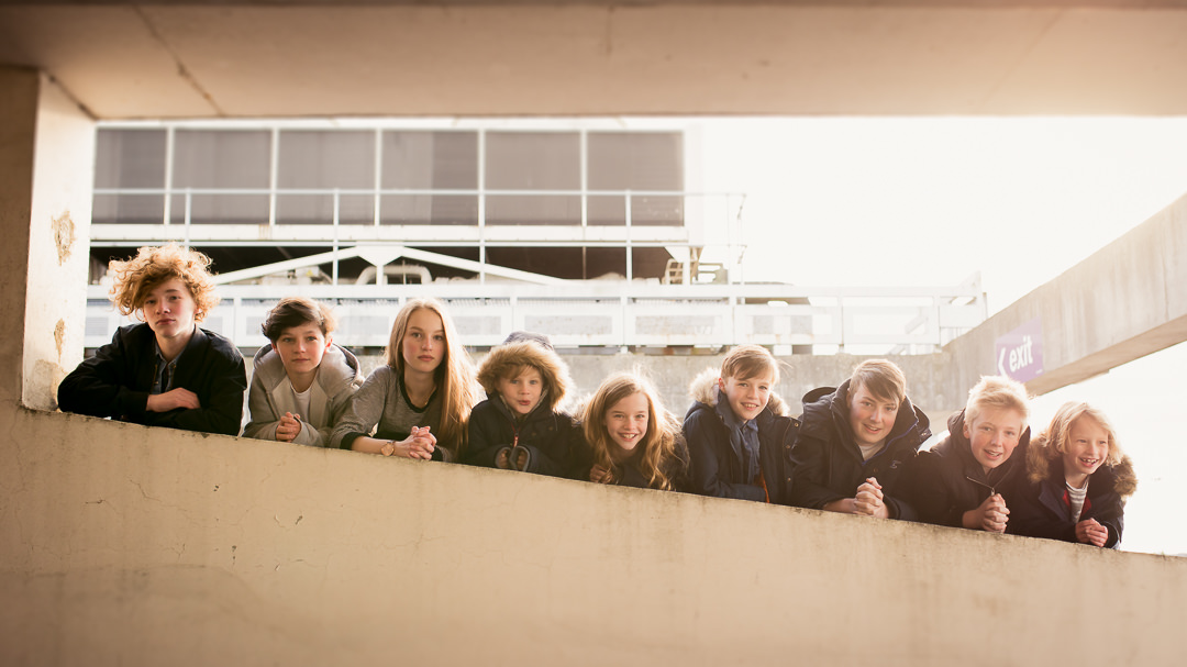 cousins pose in a car park for Hertfordshire Party Photography
