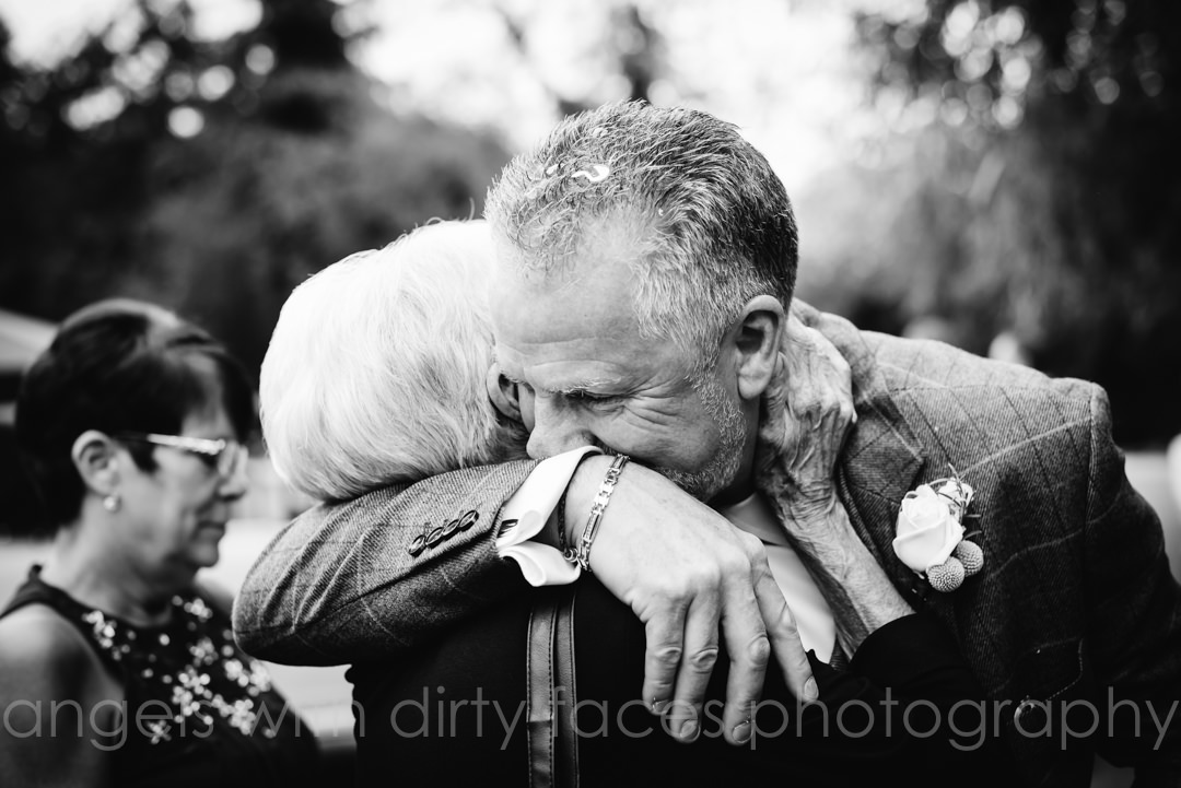 hertfordshire wedding photographer captures tender moment between groom and his mother
