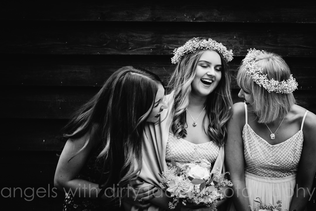 bridesmaid laugh at hertfordshire wedding at tewin bury farm 