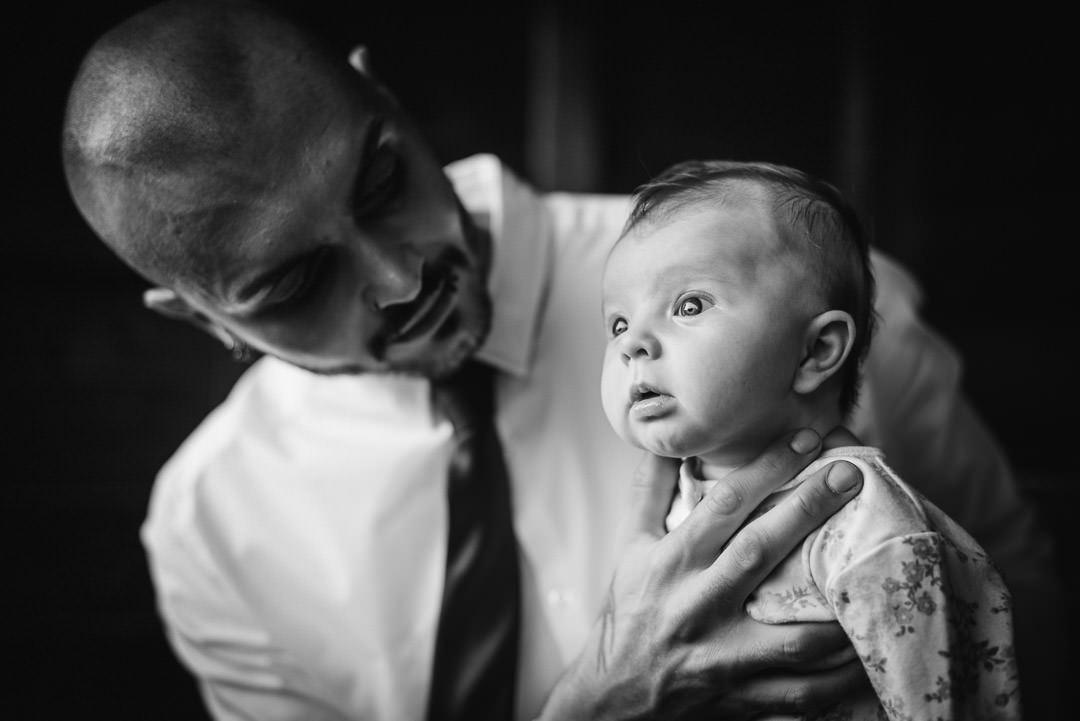 Baby peers into the light at Hertfordshire wedding