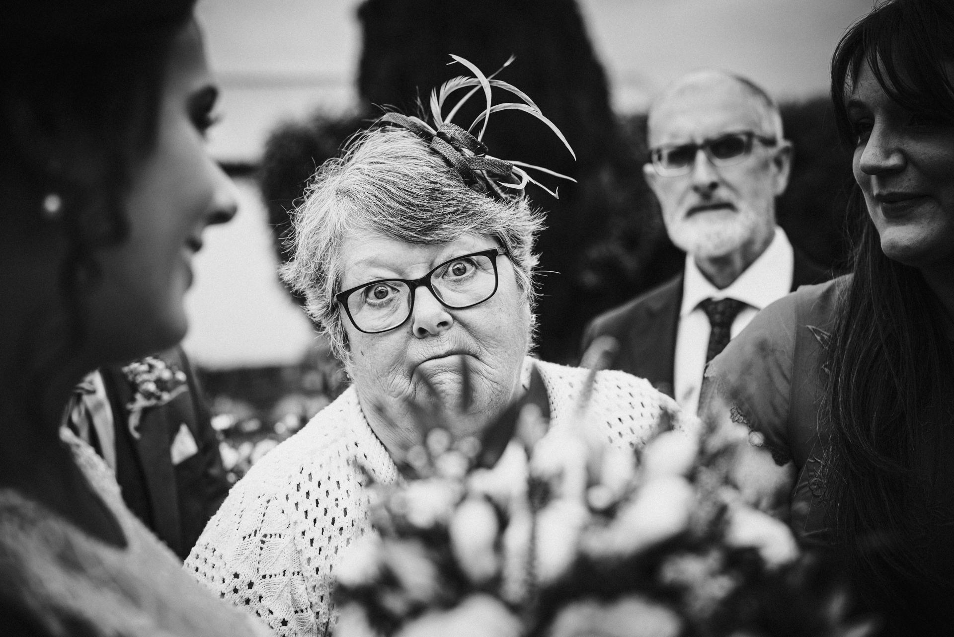 Brides grandmother pulls a face during the wedding reception