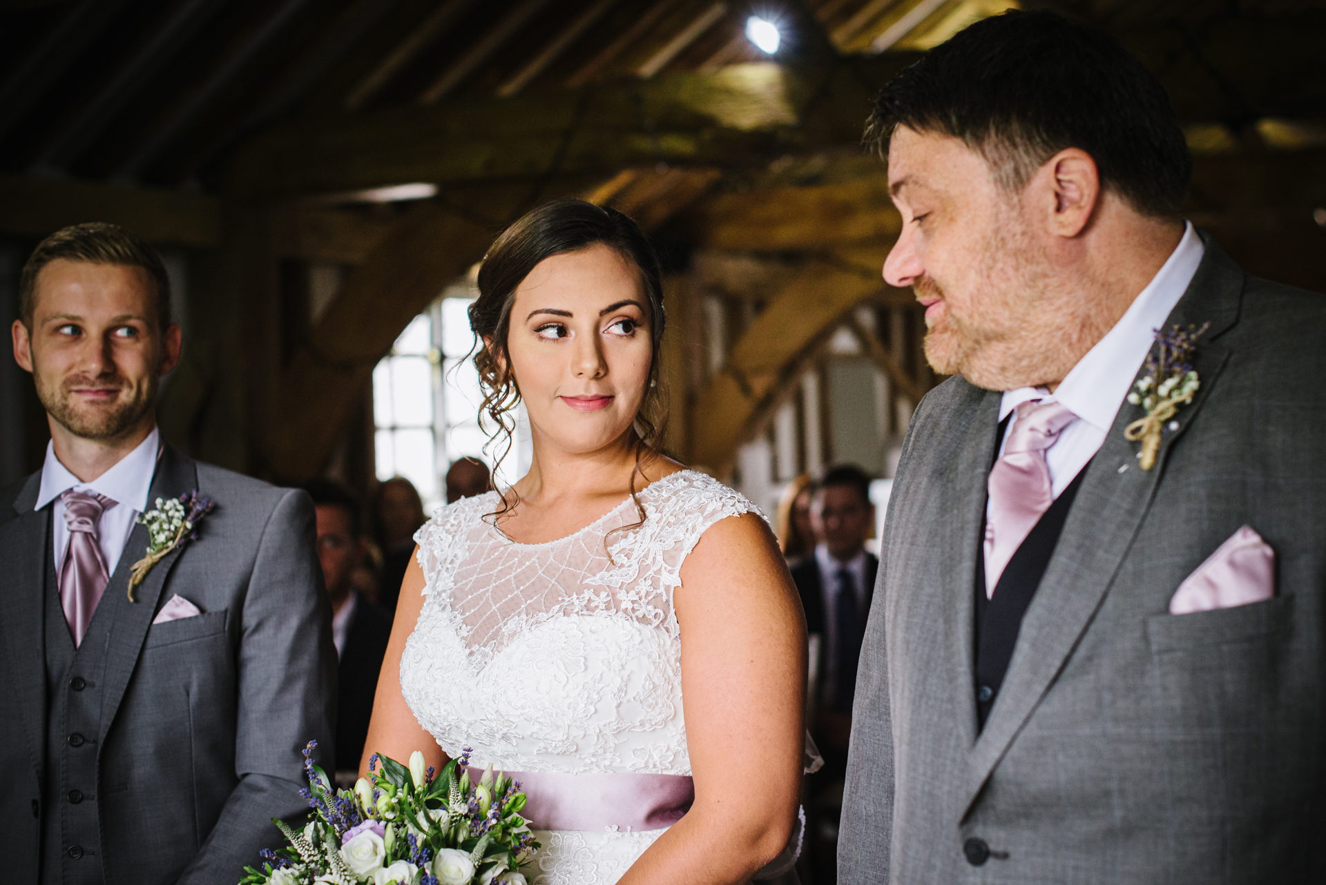 Brides looks lovingly at her dad before the Milling Barn wedding reception