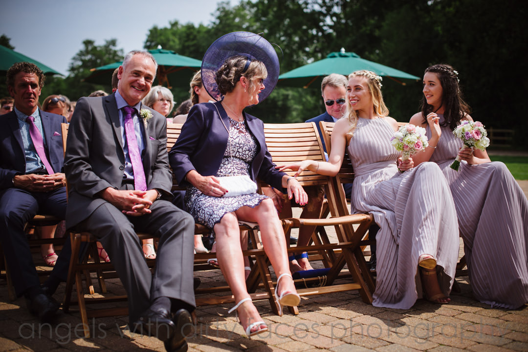 mother of the bride and bridesmaid having a joke at a tewin bury farm  hotel wedding 