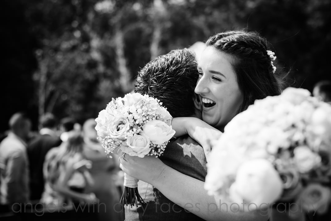  wedding photography showing elated bridesmaid laughing at tewin bury farm hotel, Hertfordshire