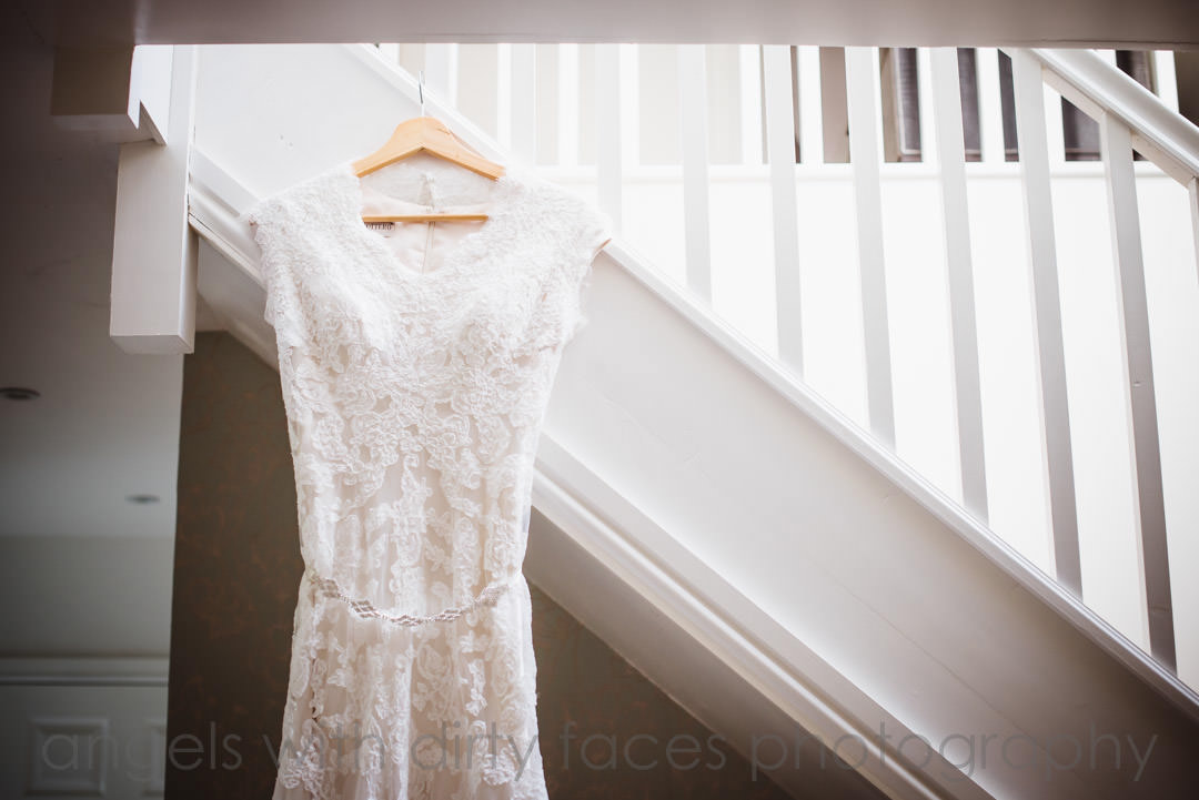  wedding dress hanging on the stairs
