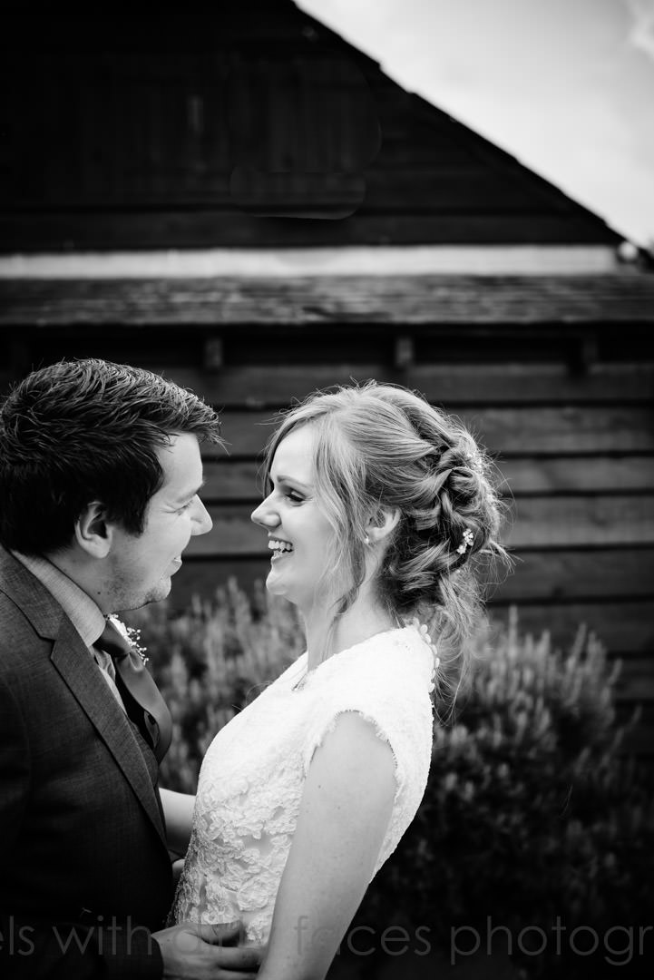 Bride and groom luiagh at their wedding at Tewin Bury Farm in Hertfordshire