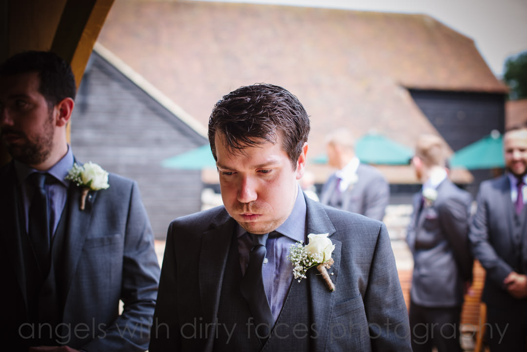 tewin bury farm hotel wedding photography showing groom looking really nervous before the ceremony 
