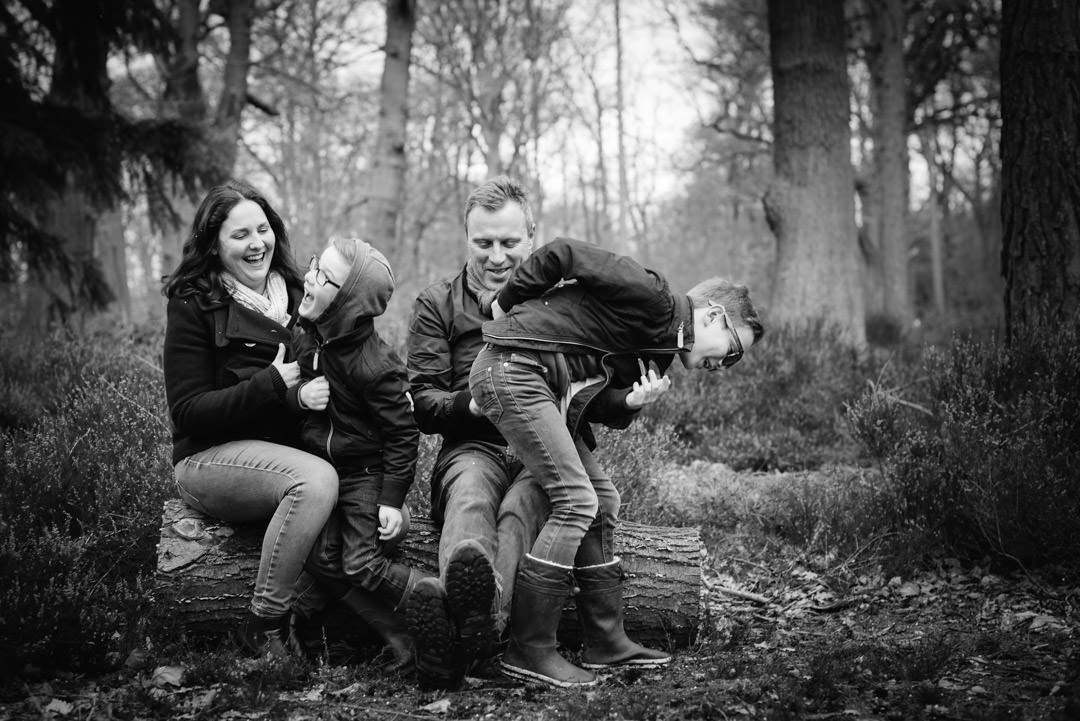 family lifestyle photography shot of family tickling each other
