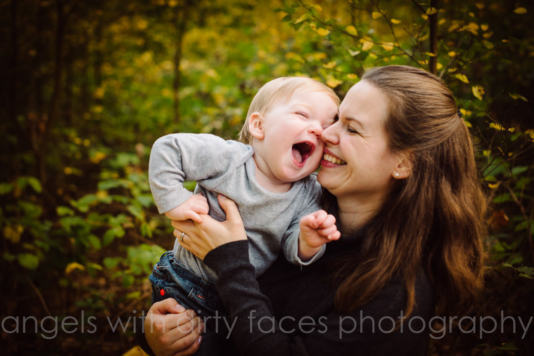 hertfordshire autumn photo shoot showing little boy with his mum having cuddles