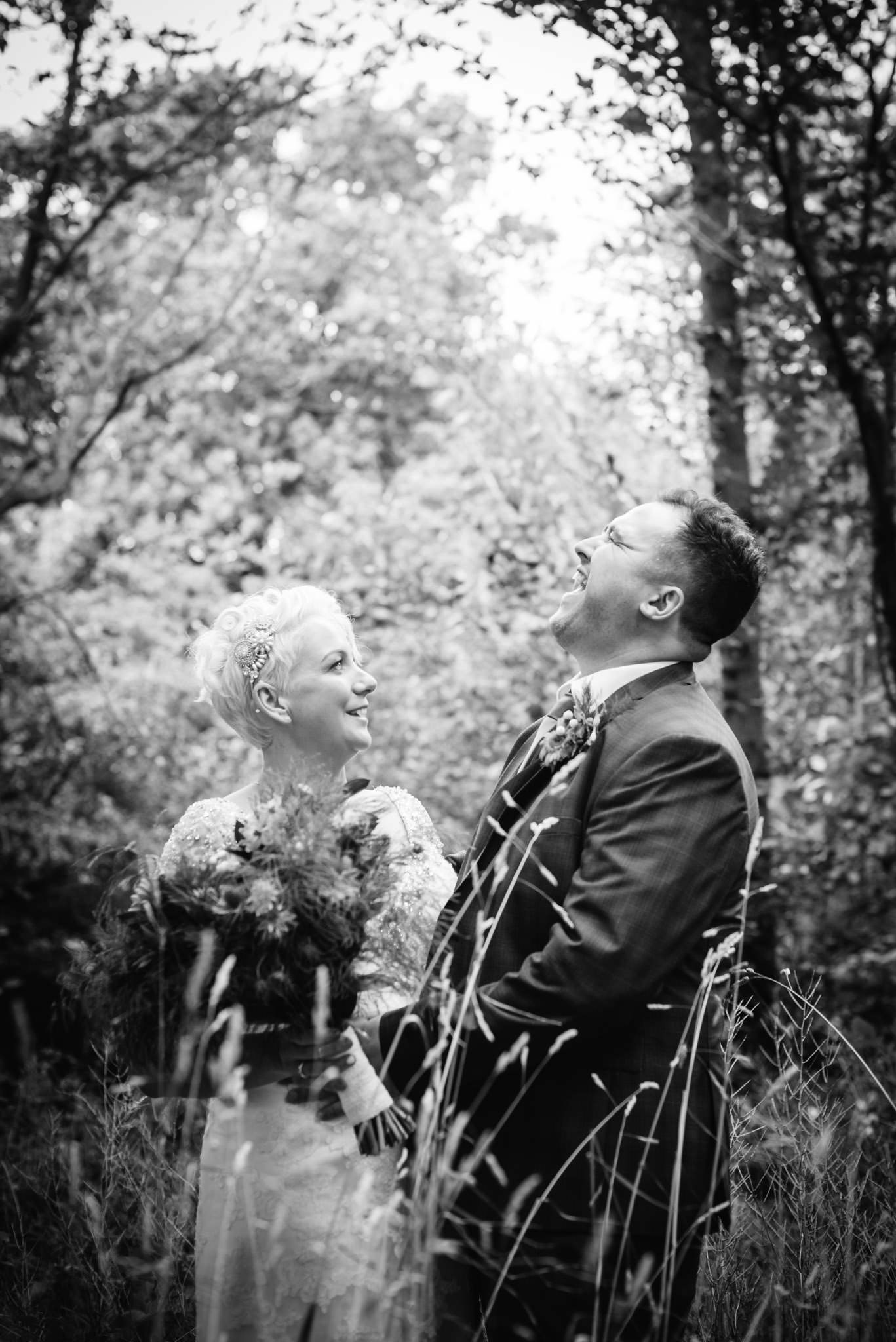 bride and groom laughing at their alwickbury park wedding