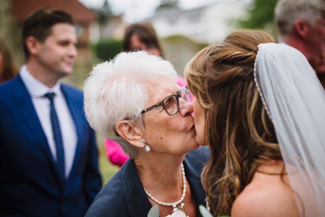 Bride kisses guest at Essendon wedding