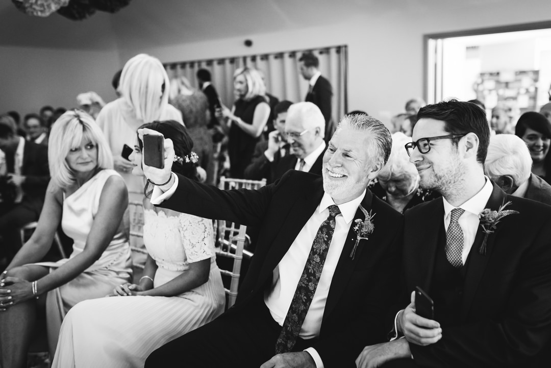 selfies being taken at a houchins farm wedding