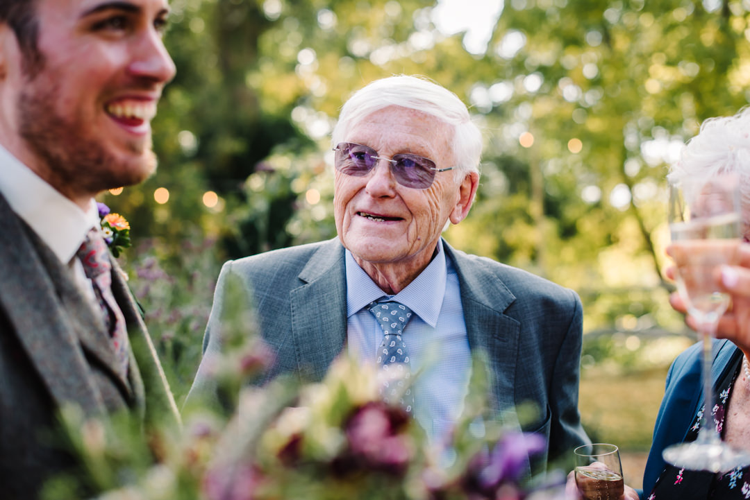 grandparent looking fondly at his grandson
