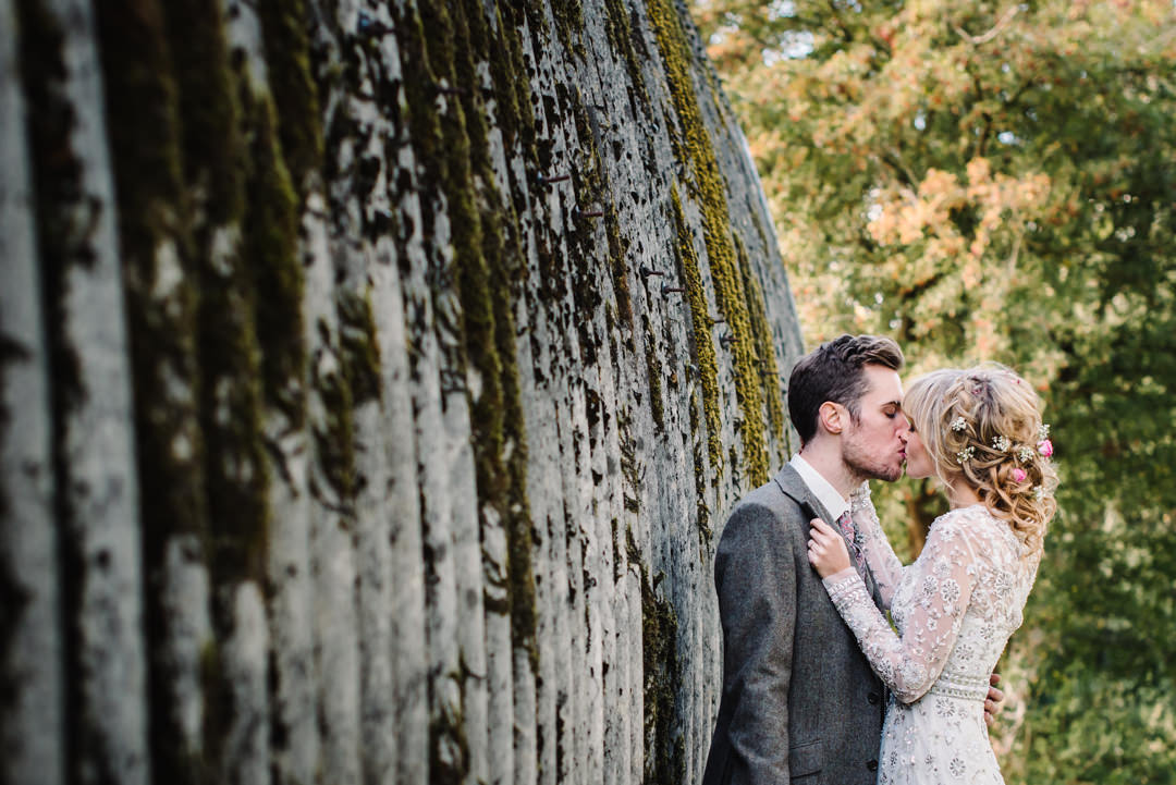 old farm buildings covered in moss at houchins farm wedding venue