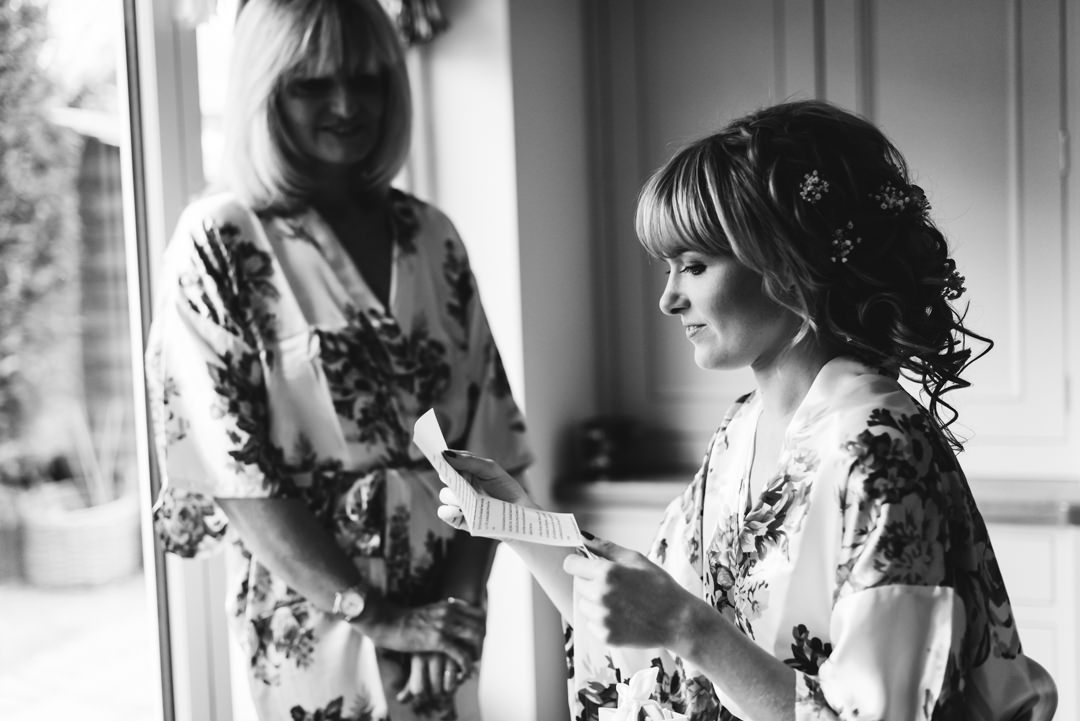 a poignant moment between a bride and her mum as she reads a personal letter