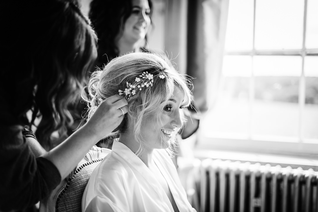 black and white photo of bridal preparation at Gosfield Hall wedding 