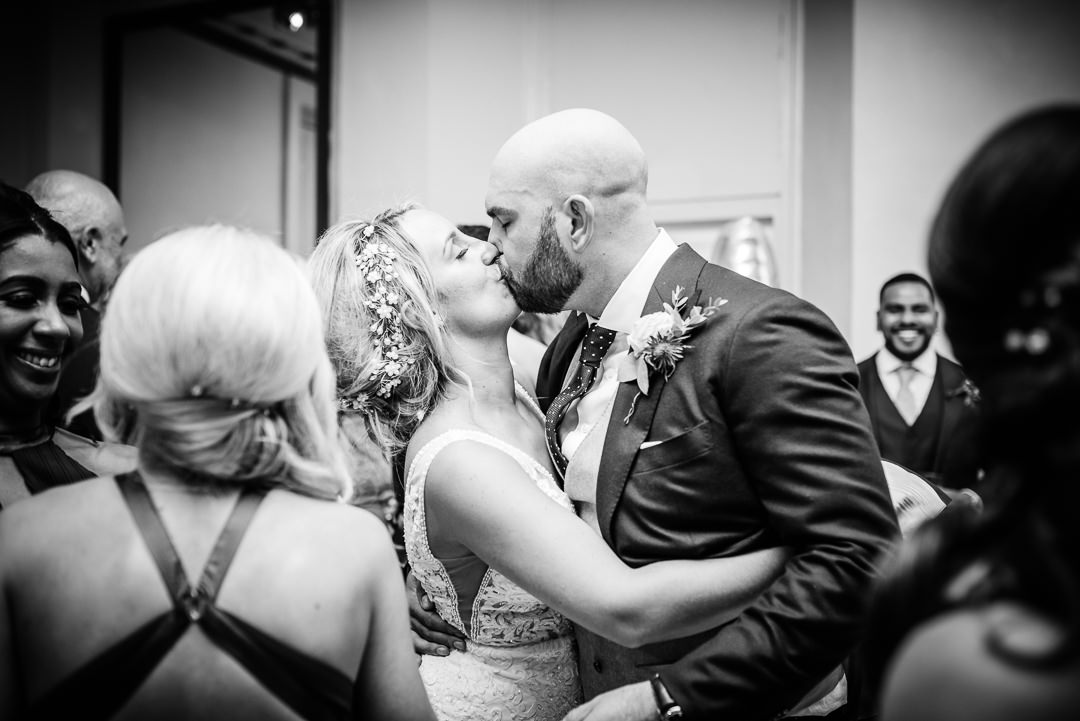 Bride and groom kiss after their first dance