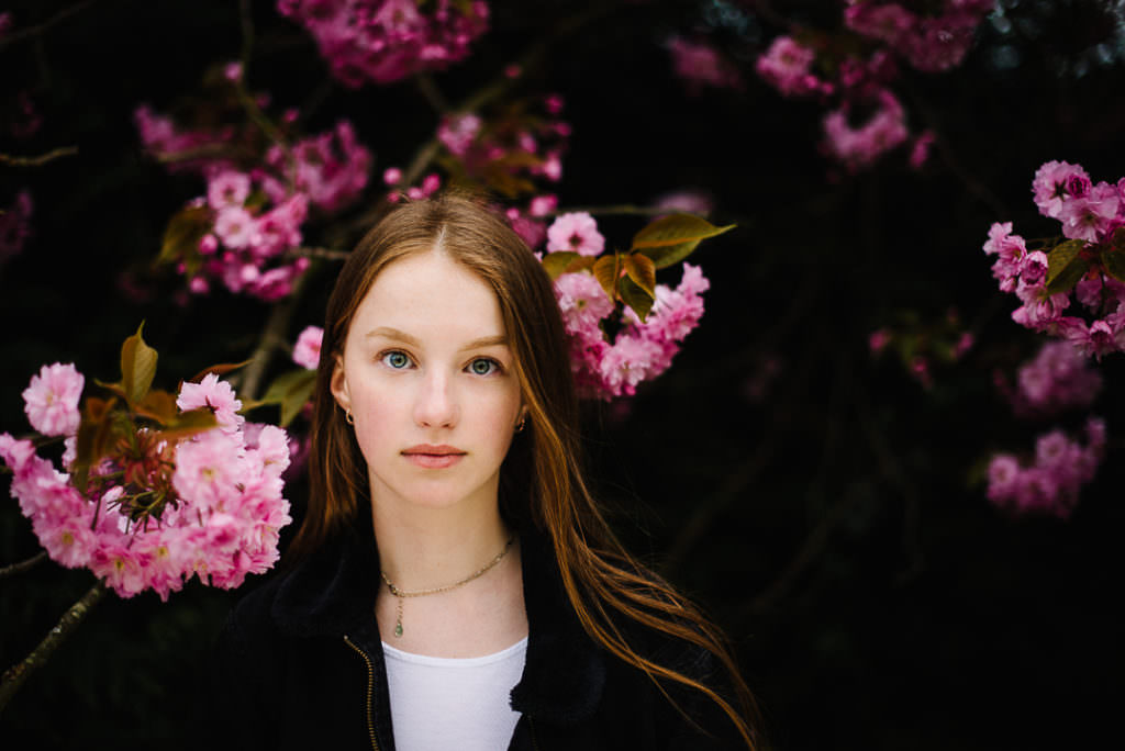 pink blossom creates a stunning back drop for Hertfordshire spring portrait photography
