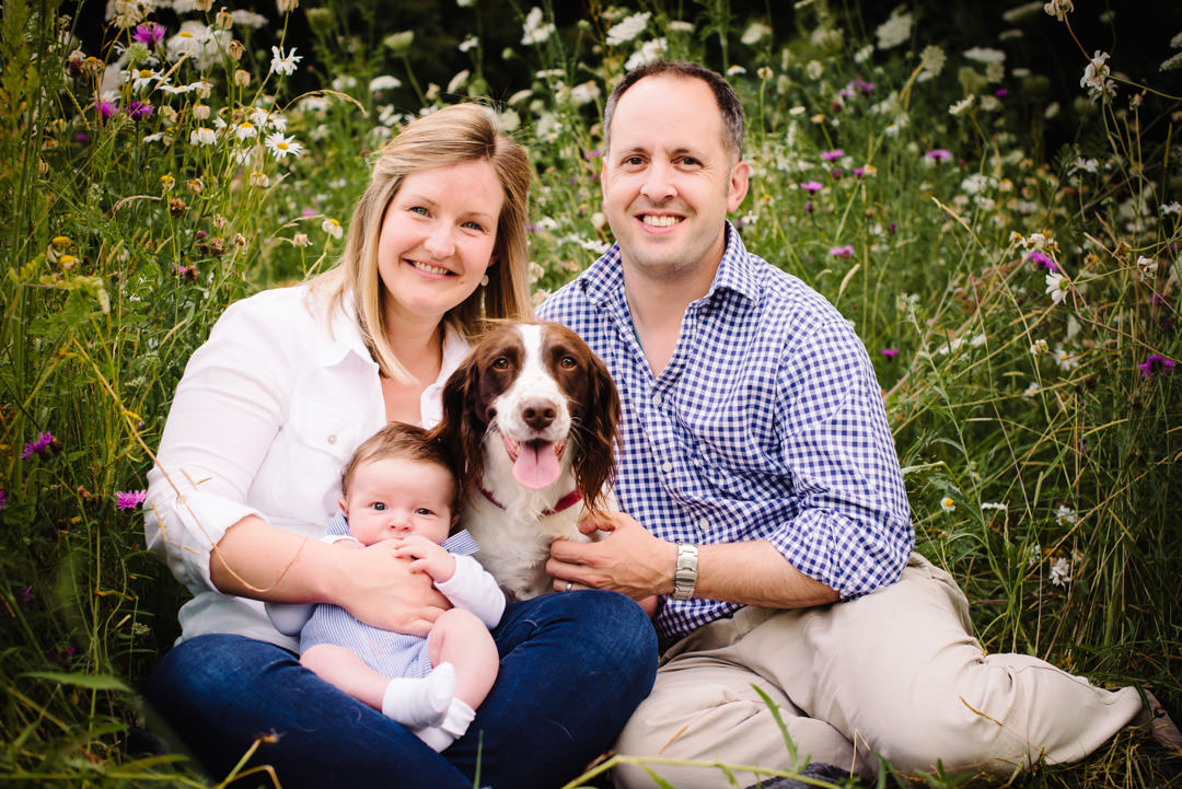 New family and their dog sit for a relaxed family photograph in St Albans.