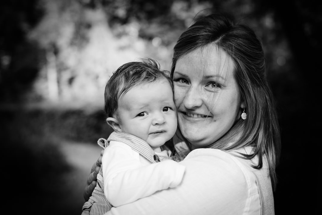 New mother and her tiny son have a cuddle for their family photog shoot in St Albans.