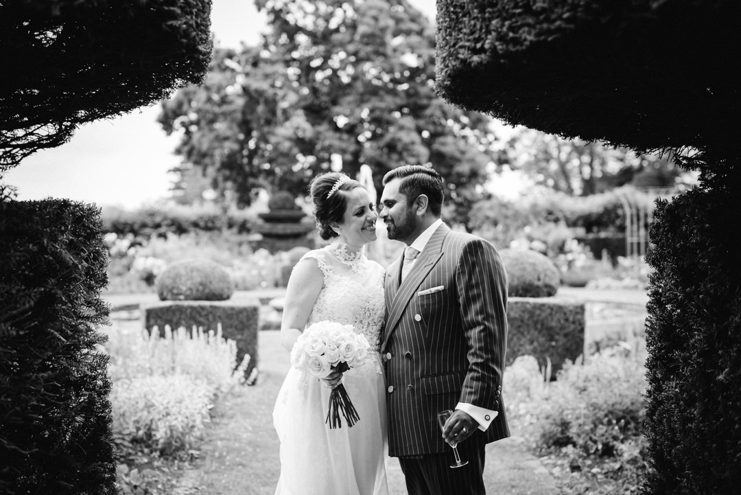 bride and groom share a little kiss during their hatfield house wedding