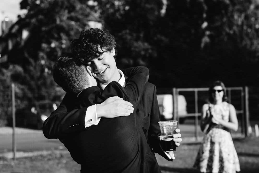 welwyn garden city groom and his best man hug after speeches