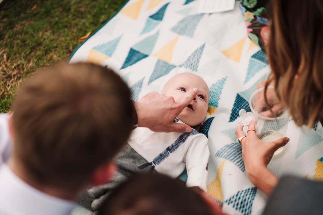 baby wedding guests gets a nose poke