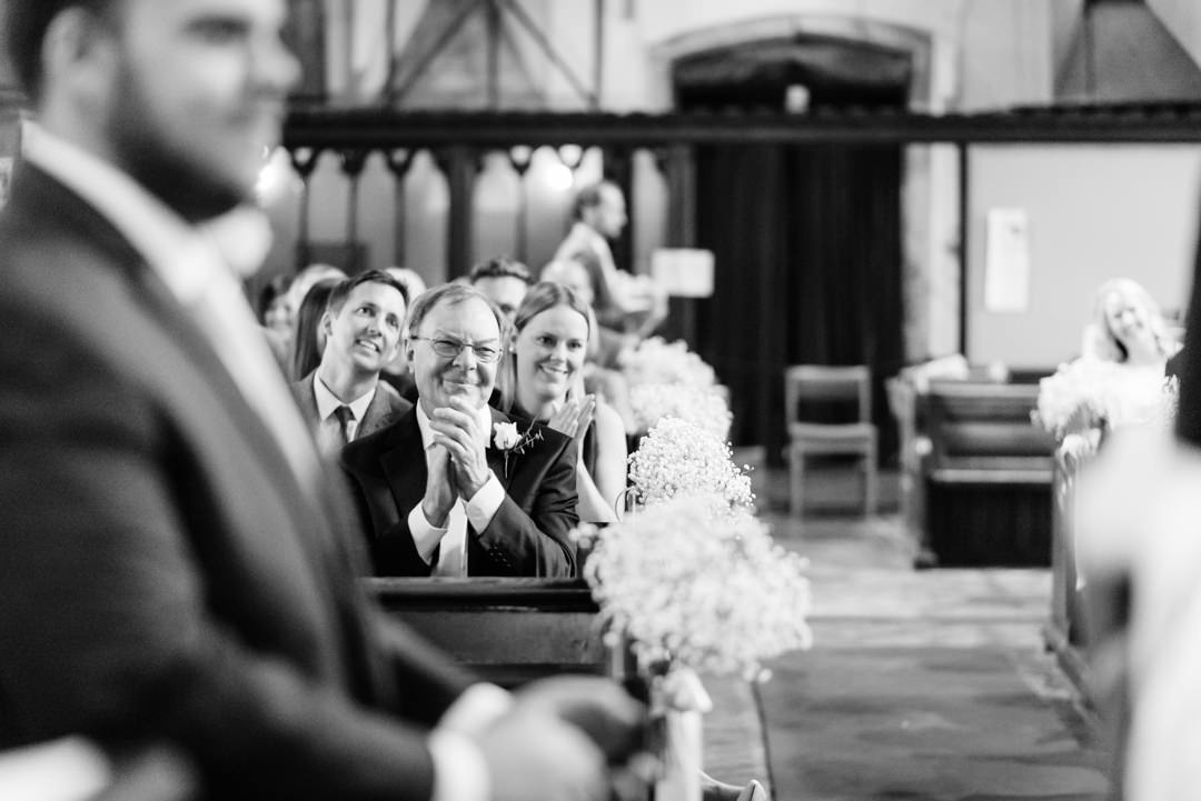 father of groom watches harpenden wedding ceremony proudly