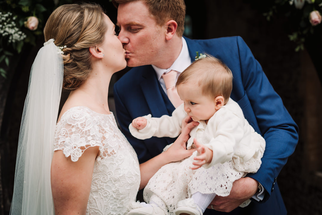 bride and groom kiss for their harpenden wedding photographer