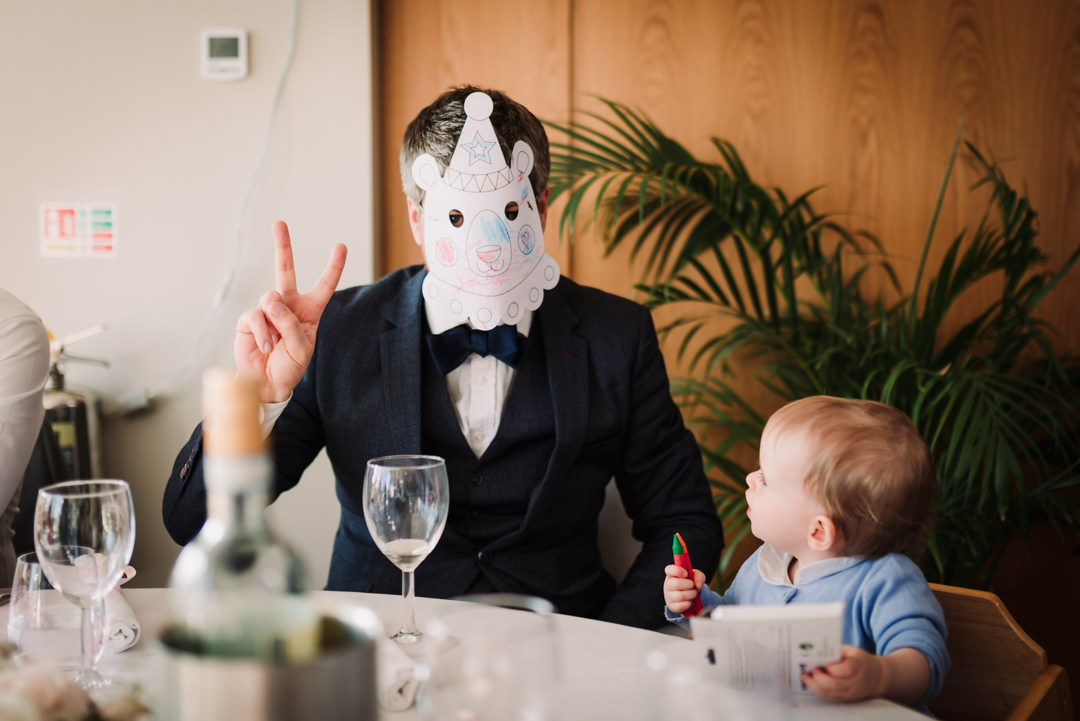 harpenden golf club wedding guest wears a kids mask as a joke for his son
