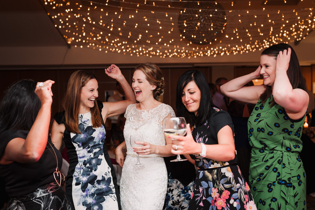 bride and her friends dance at the harpenden golf club wedding reception