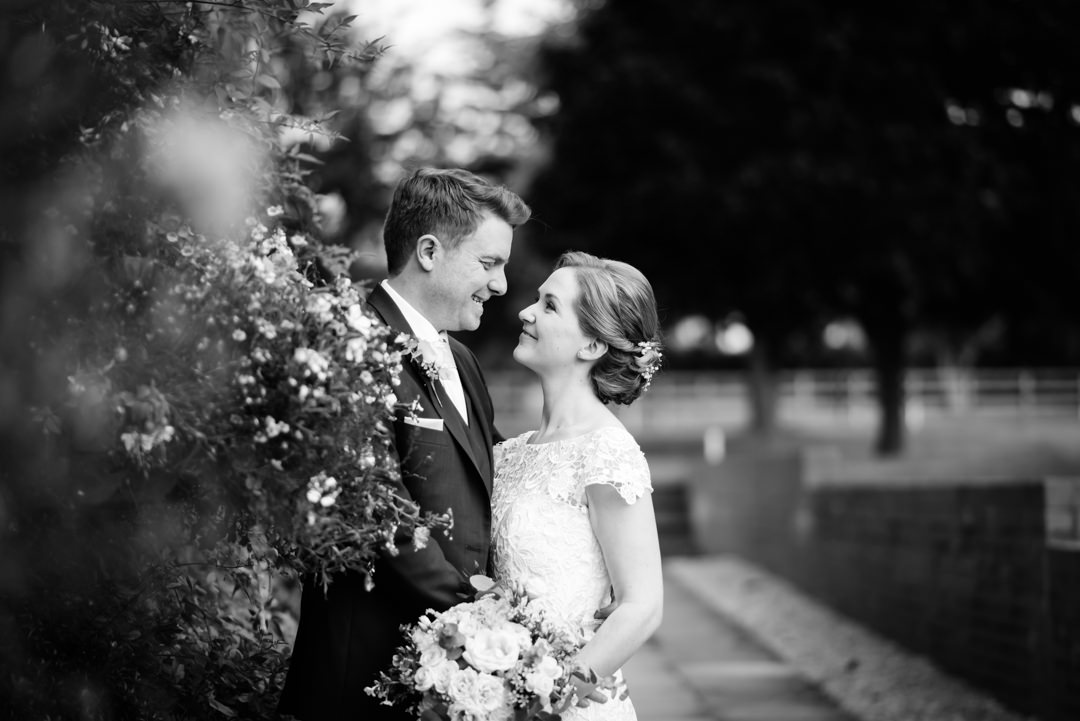 classic harpenden wedding photographer portrait of bride and groom looking lovingly at each other.