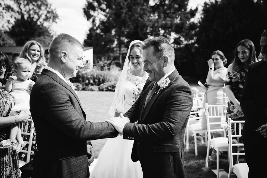 father of bride meets groom at the alter of sheene mill wedding