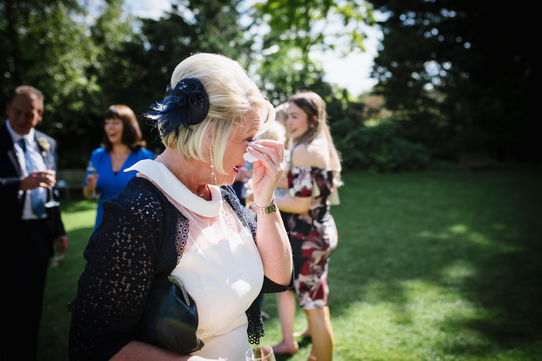 mother of groom sheds a tear after sheene mill wedding ceremony
