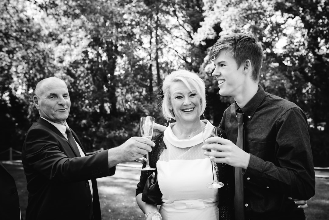 guests raise a glass at sheene mill wedding