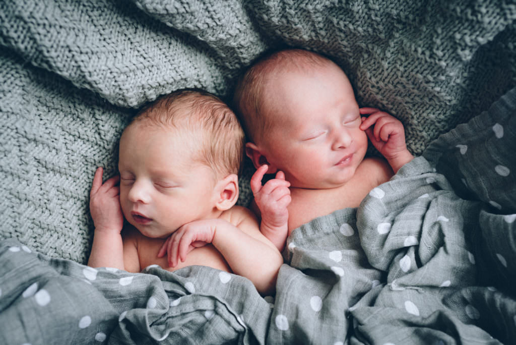 twin babies sleep squashed together calmly