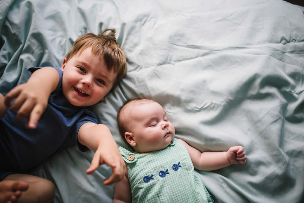 brothers play together on their family photo shoot