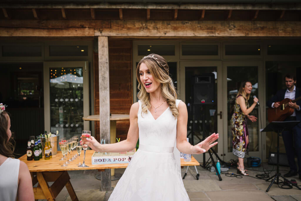 bride dances to the band at houchins