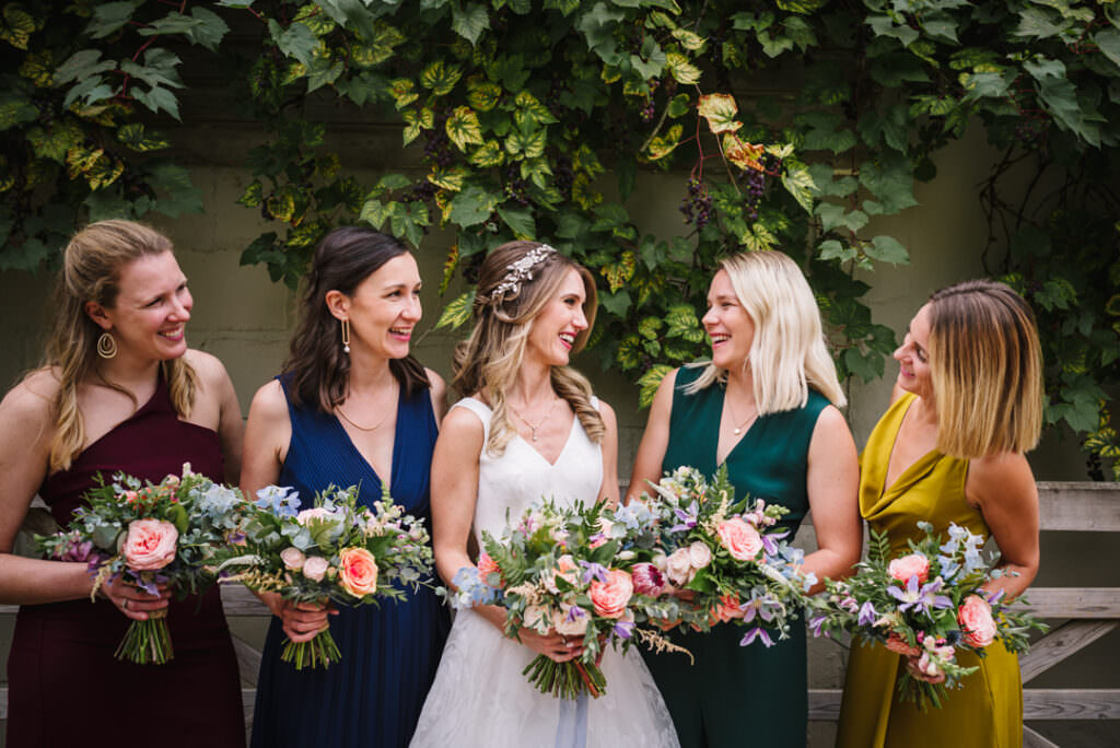 bride and her bridesmaids at houchins farm wedding