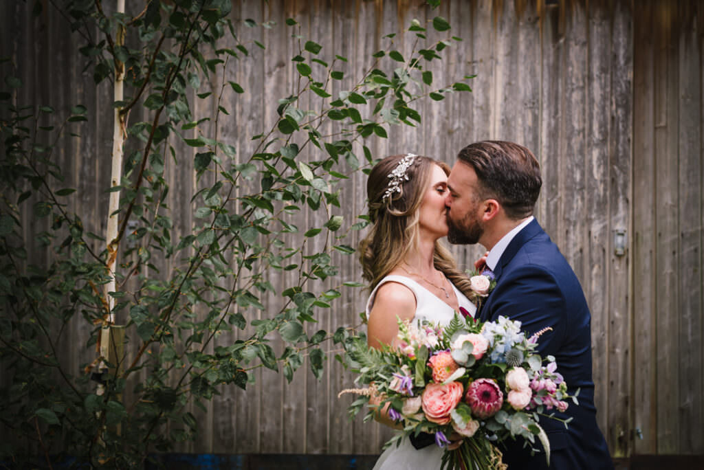 houchins wedding photographer captures bride and groom kissing